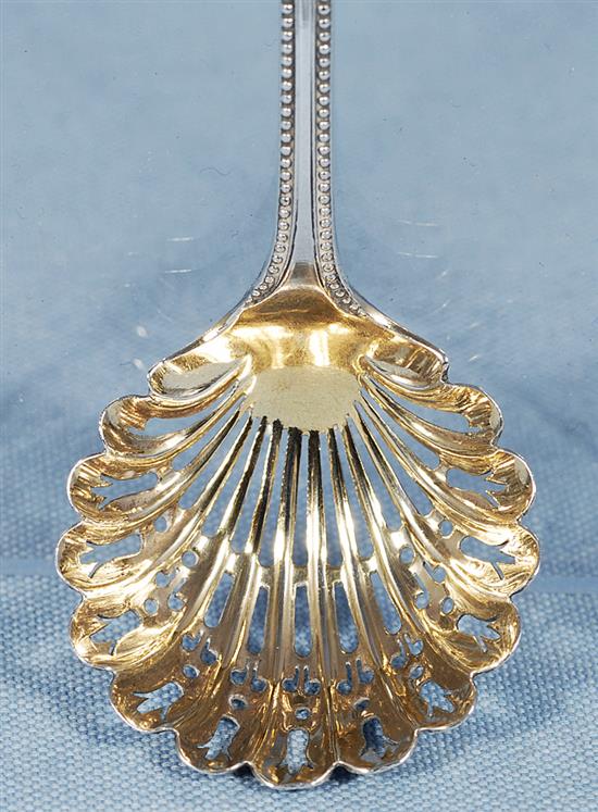 A Victorian silver swing handled sugar basket and sifter spoon, by Martin, Hall & Co, basket height 190mm, weight 7.7oz/241grms.